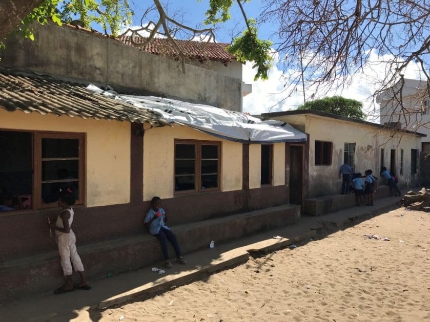 A classroom with a tarpaulin for a roof