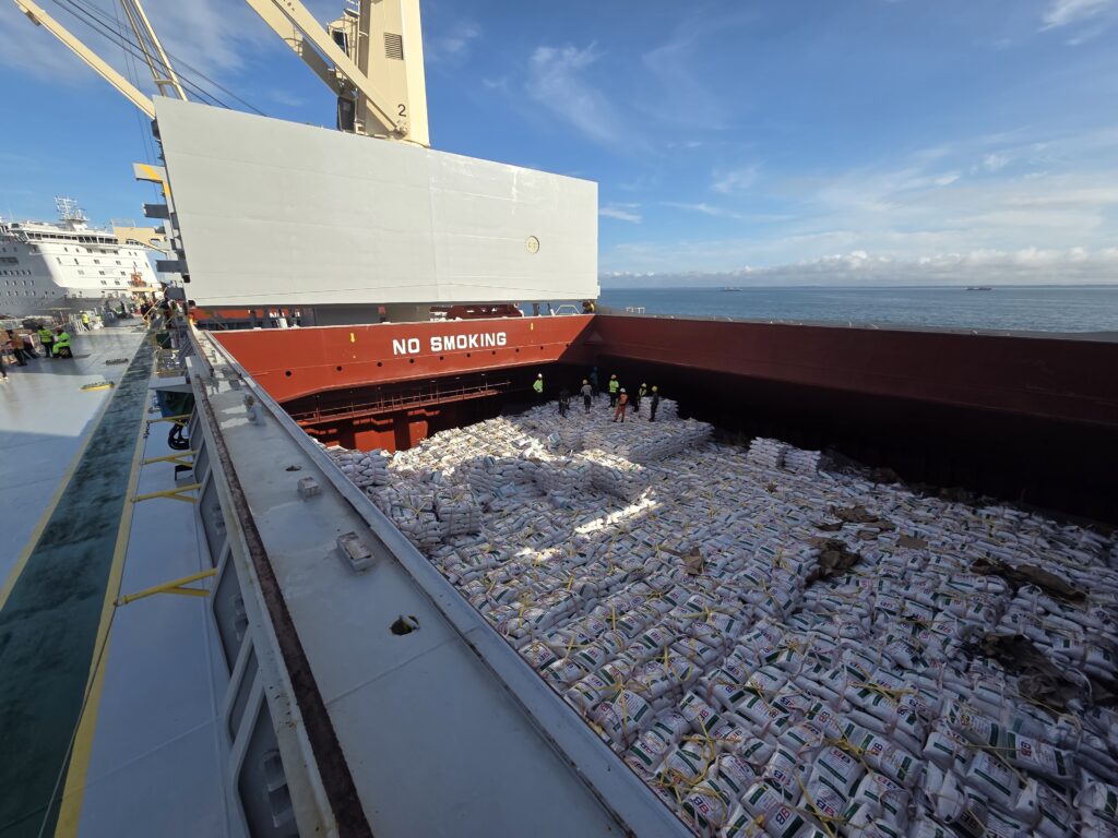 Unloading bagged rice shipment at NSBT